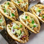 Overhead shot of blackened fish tacos in a taco holder.