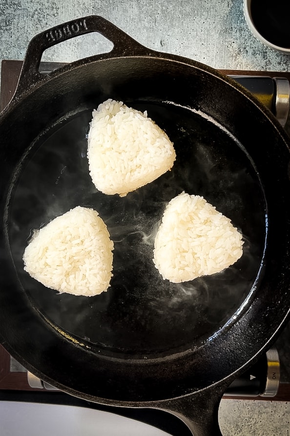 Fried rice with yaki onigiri served alongside a cup of coffee.