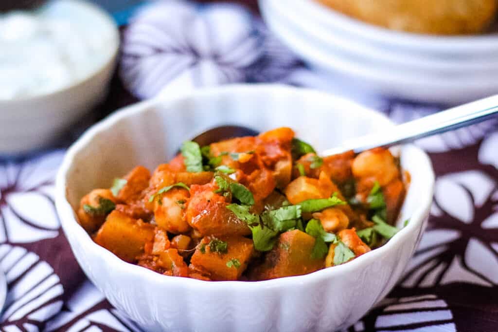 low angle image of a bowl of chana masala.