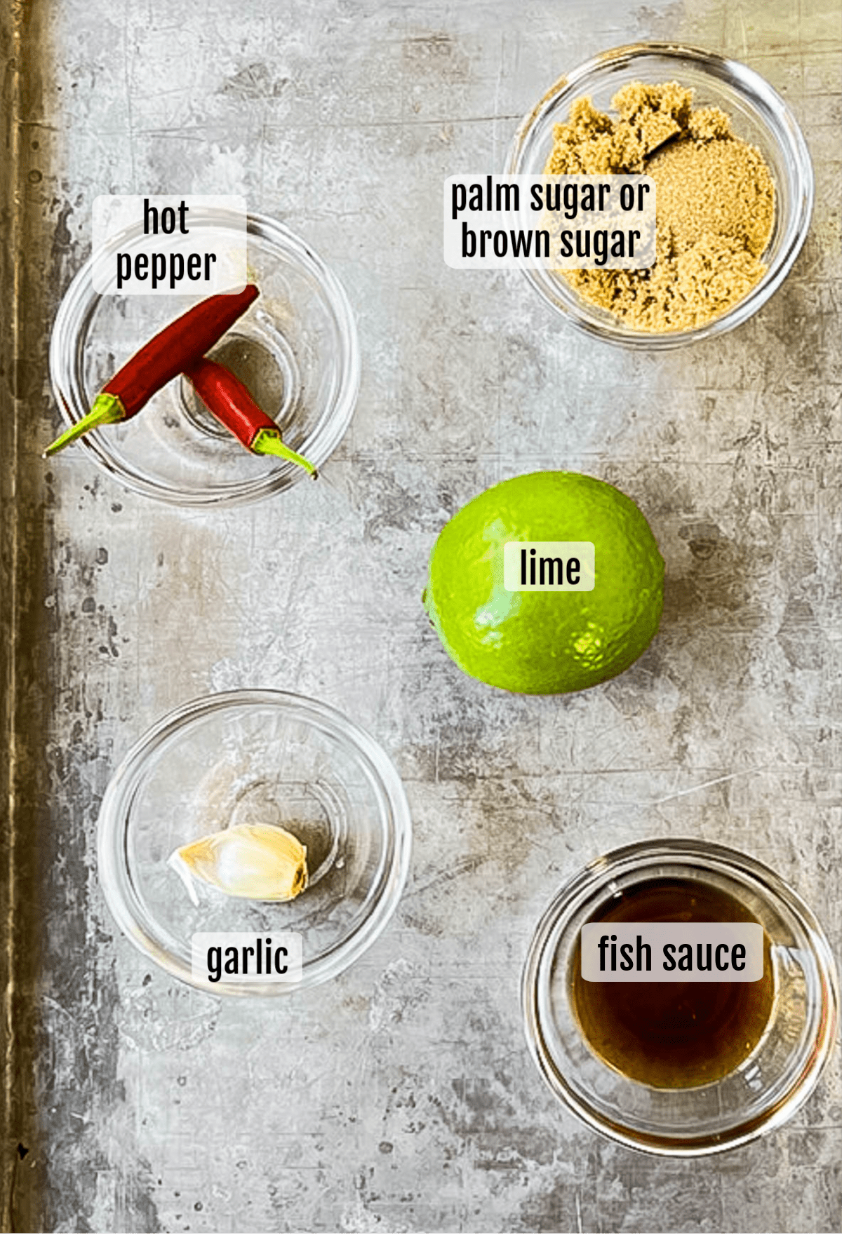 Overhead shot of the ingredients needed to make pad woon sen noodle salad dressing.