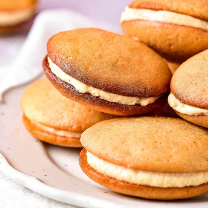 low angle shot of a pile of caramel whoopie pies.