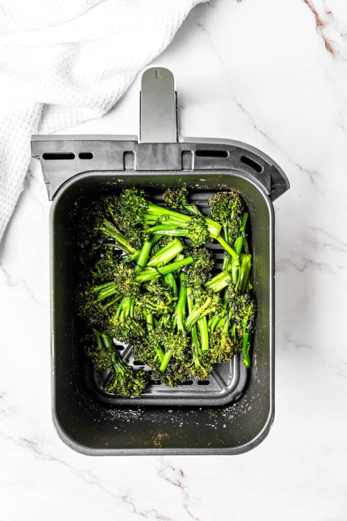 Step 4 for making air fryer broccolini: Air fry broccolini.