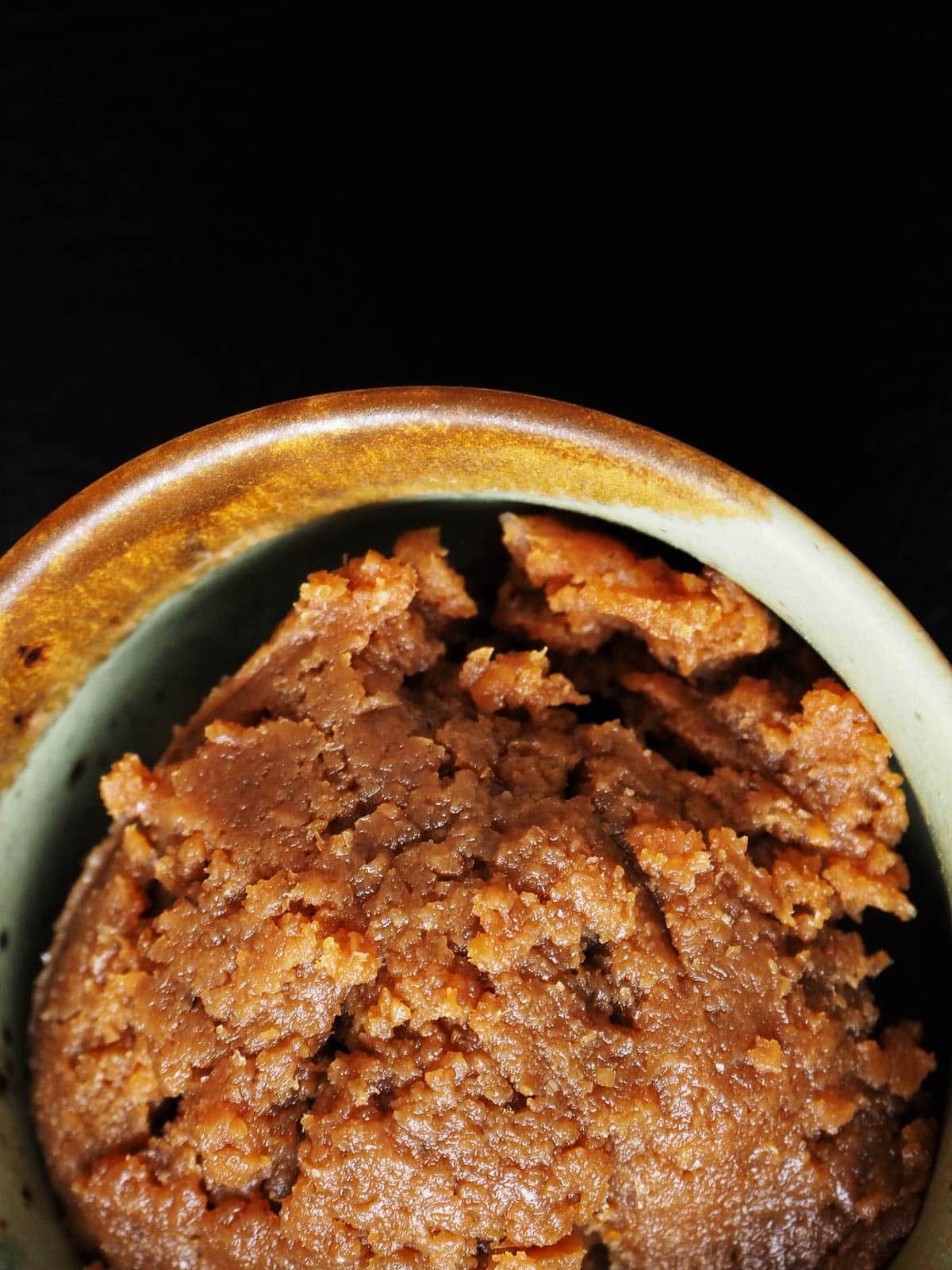 Overhead shot of miso paste in a ceramic bowl.