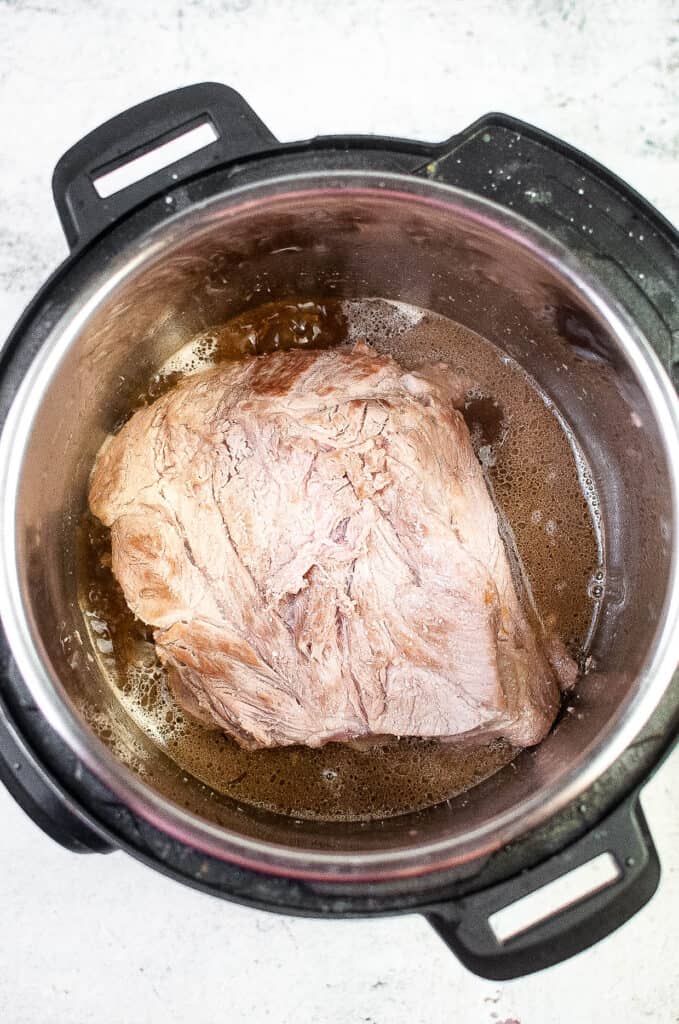 add pork back and liquid smoke and salt.