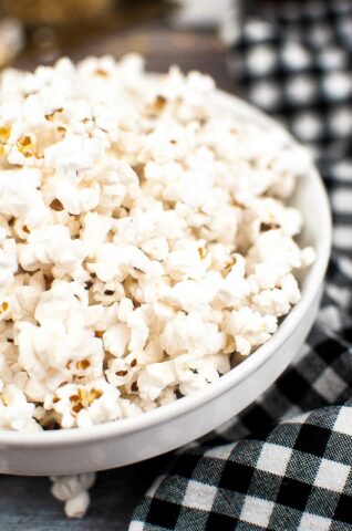 close up of air fryer popcorn in a white bowl.