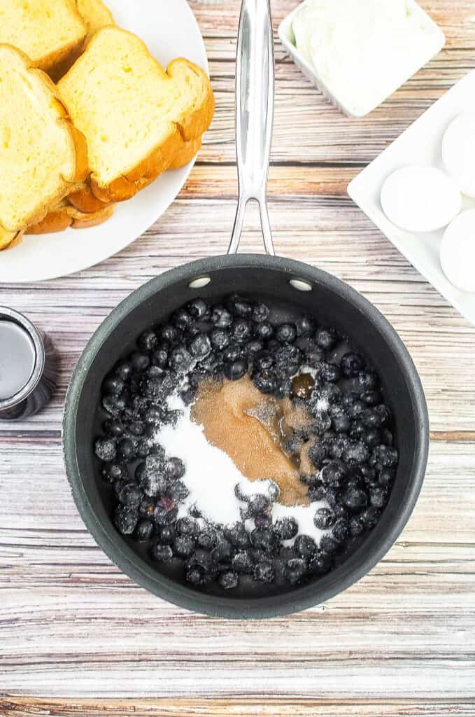 blueberries and sugar in a saucepan.