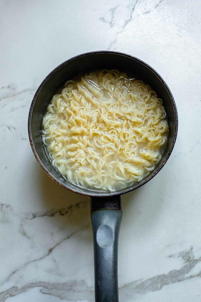 Boiling noodles in a pot.