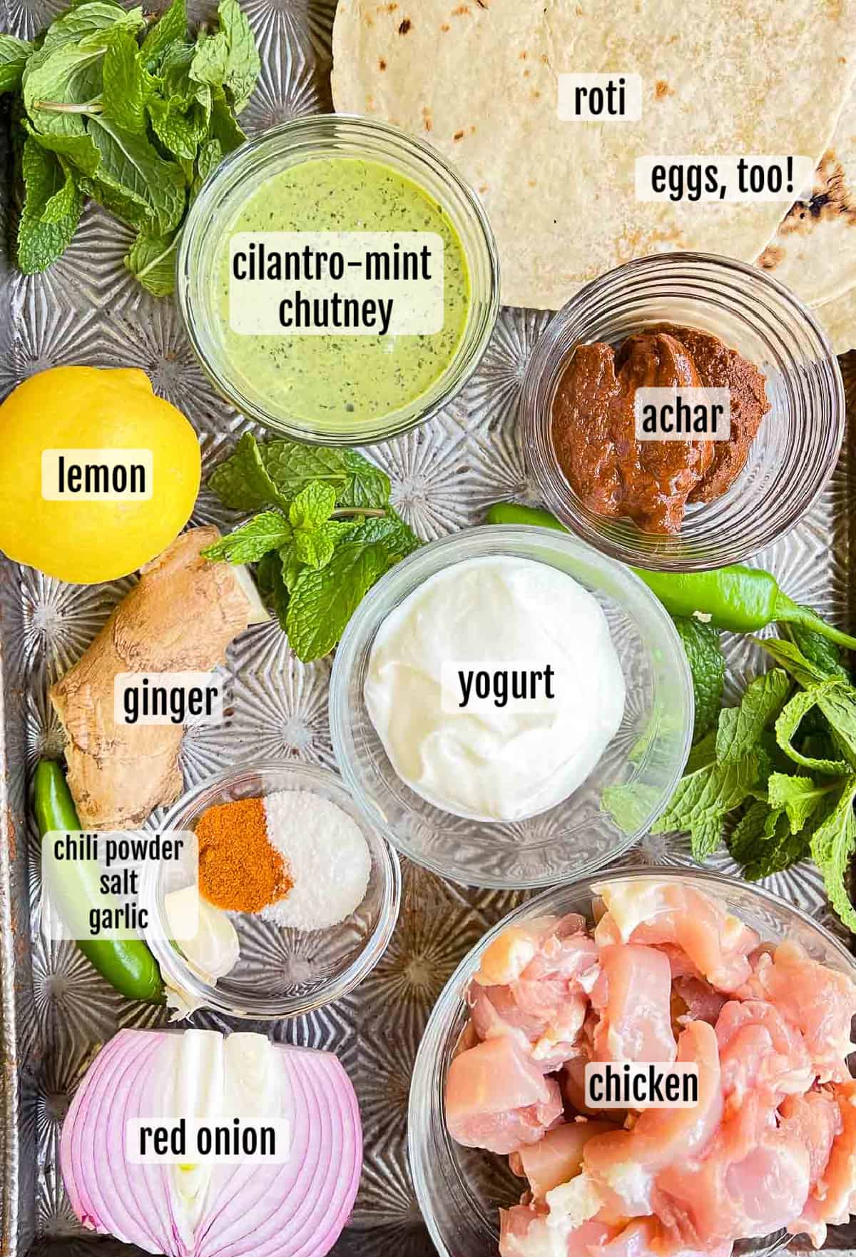 Overhead photo of the ingredients needed to make chicken kathi rolls.