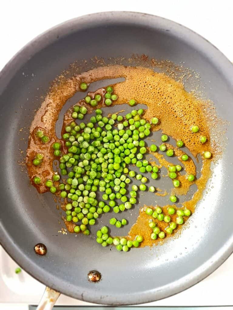 peas and spices in a skillet.
