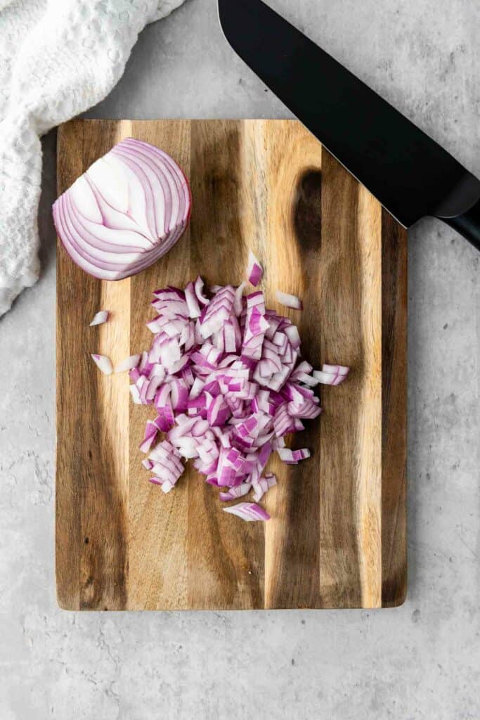 diced red onion on a cutting board.