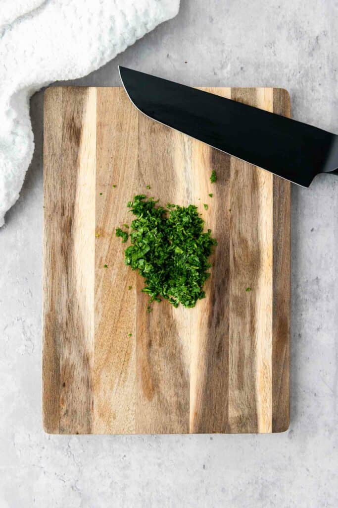 chopped cilantro on a cutting board.