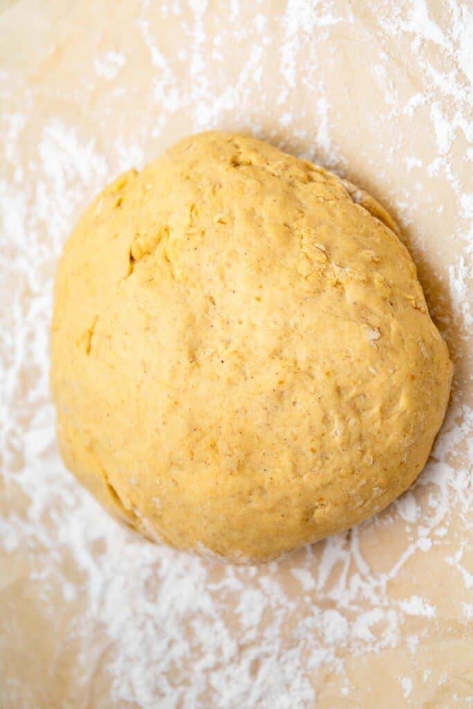 A dough ball on a floured surface.