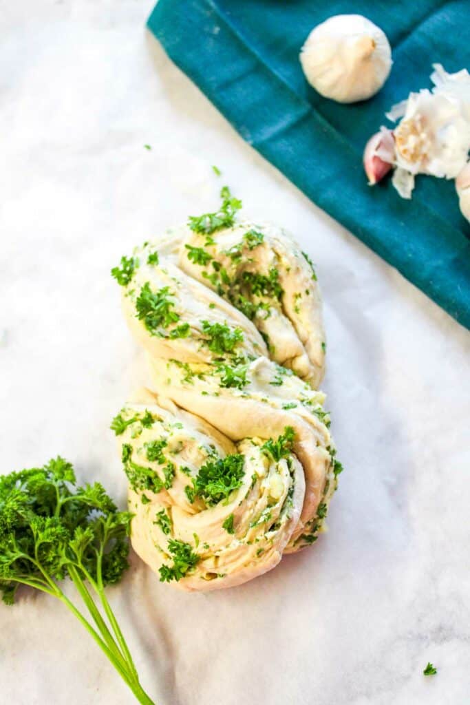 A loaf of bread with garlic and parsley.