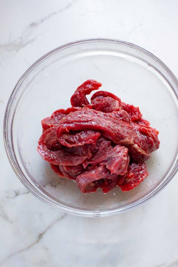 A bowl of raw meat.