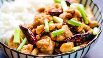 Speedy Chinese chicken with peanuts and onions in a bowl.