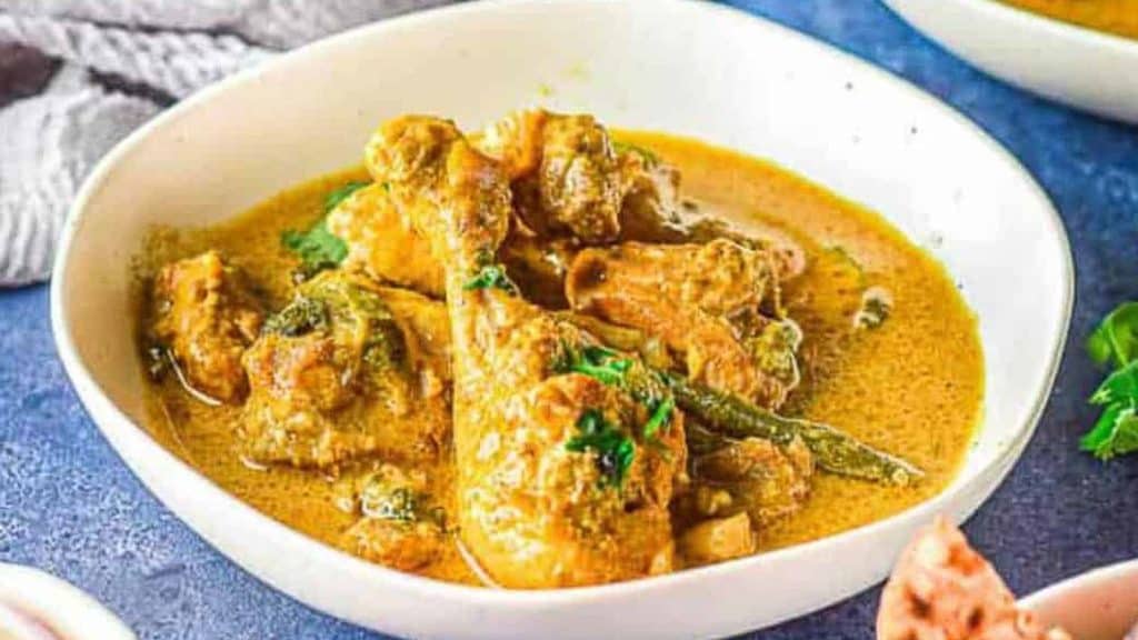Outrageously Delicious Chicken curry in a white bowl.