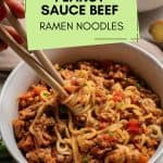 A bowl of peanut sauce ramen noodles with chopsticks.