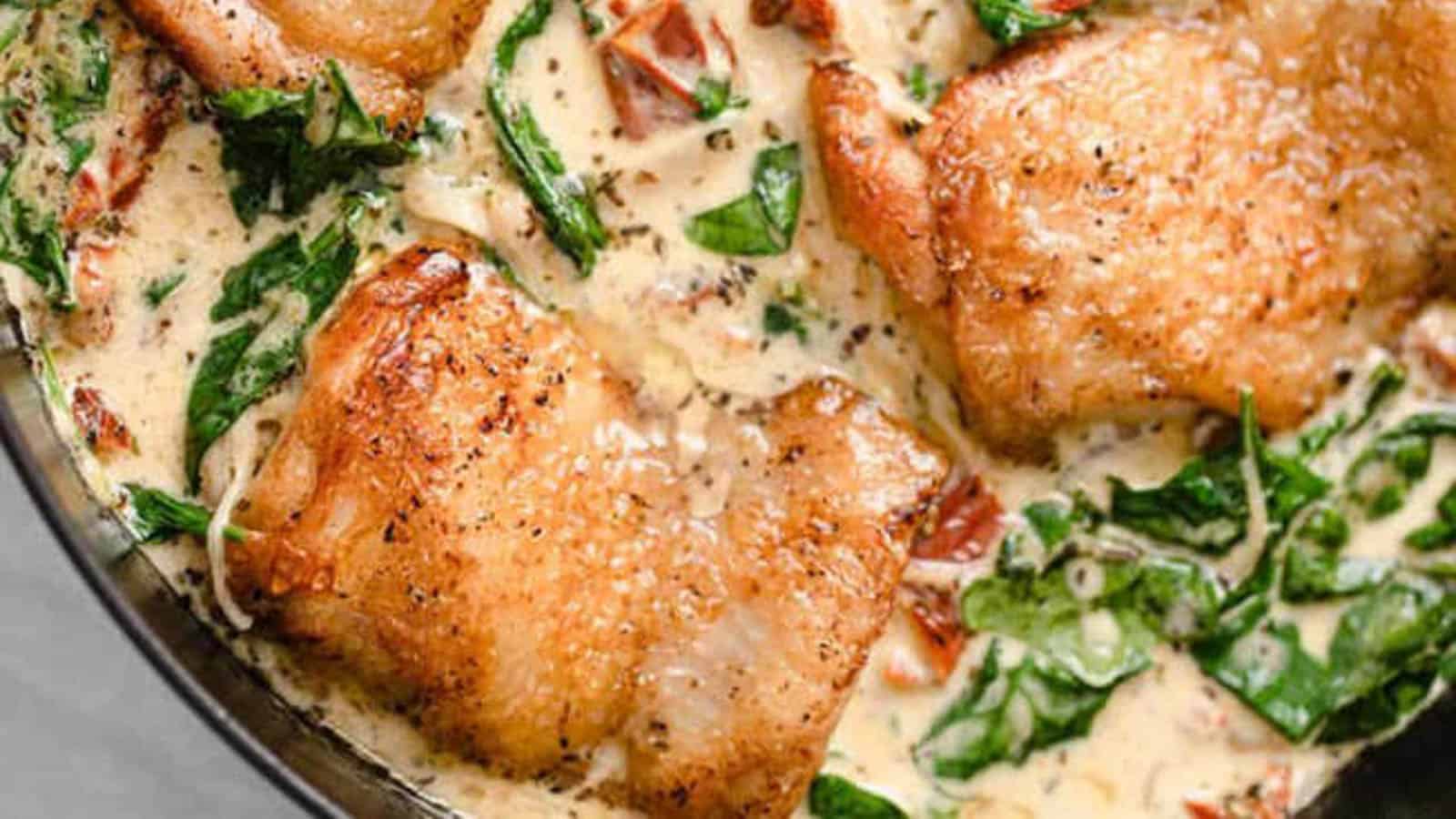 Creamy Tuscan chicken in a skillet.