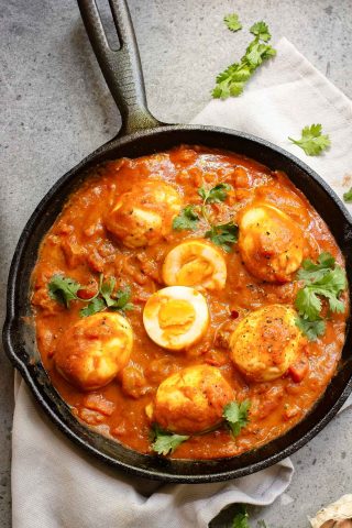 A pan of food with eggs and sauce.