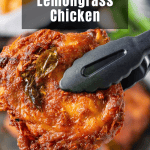 A piece of cooked lemongrass chicken held by black tongs with a bowl of food in the blurred background. The text "Lemongrass Chicken" is displayed at the top.
