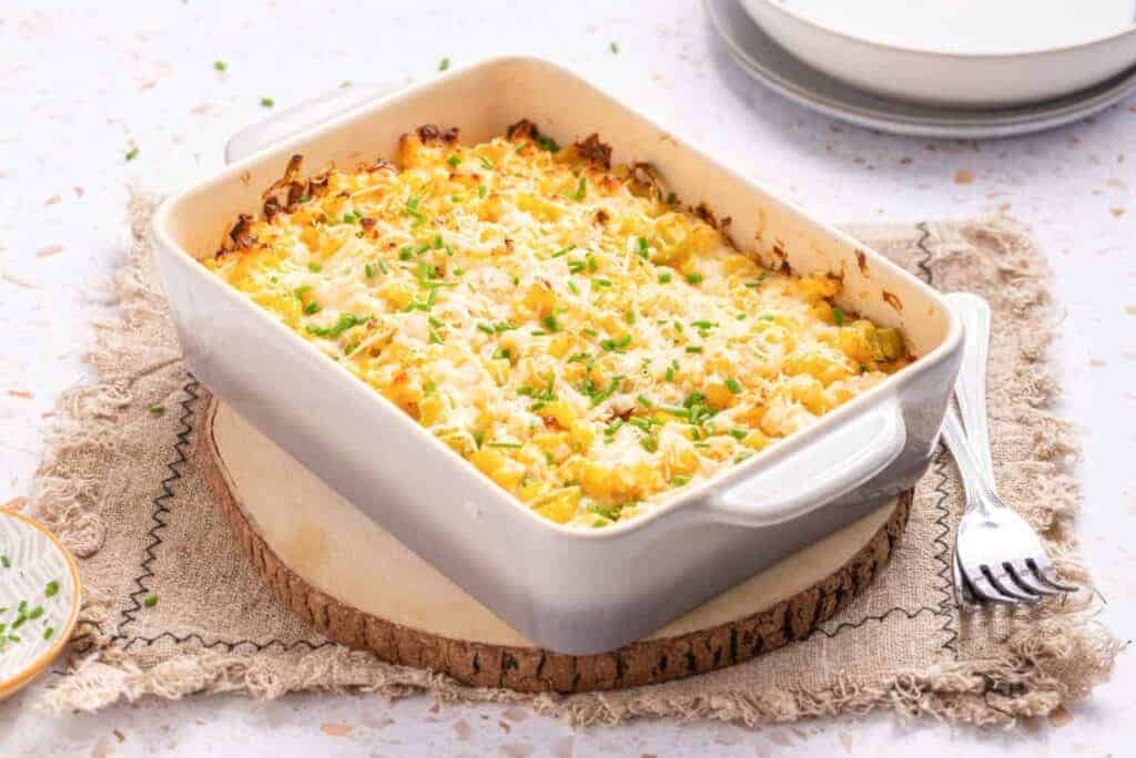 An image of corn casserole with cream cheese, ready to be served.