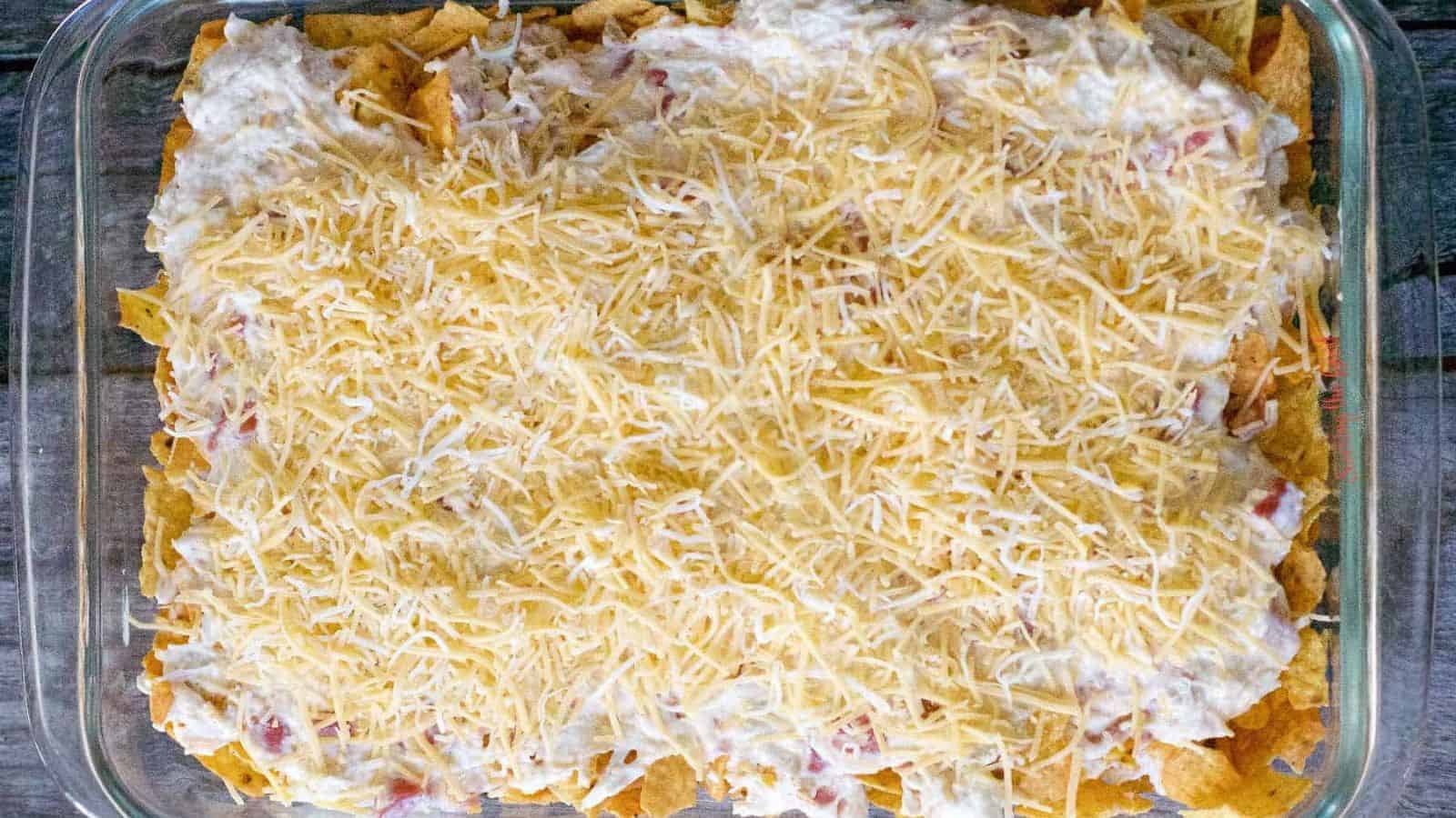 Dorito Chicken Casserole in a pyrex ready for the oven.