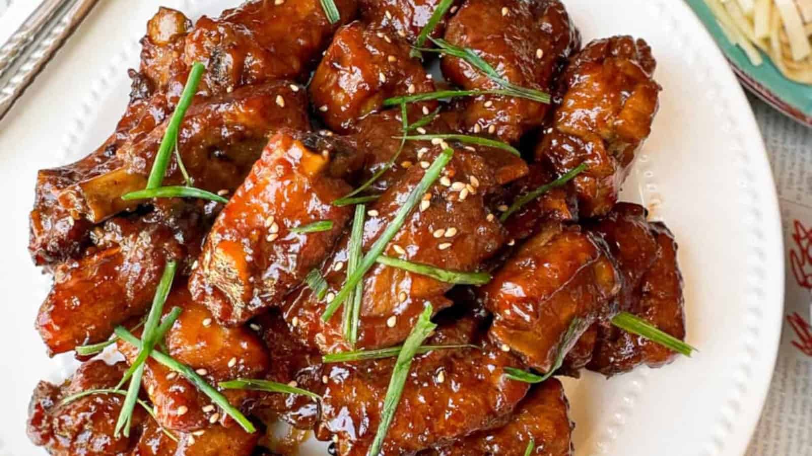 Sticky and flavorful Peking-style spare ribs on a plate.