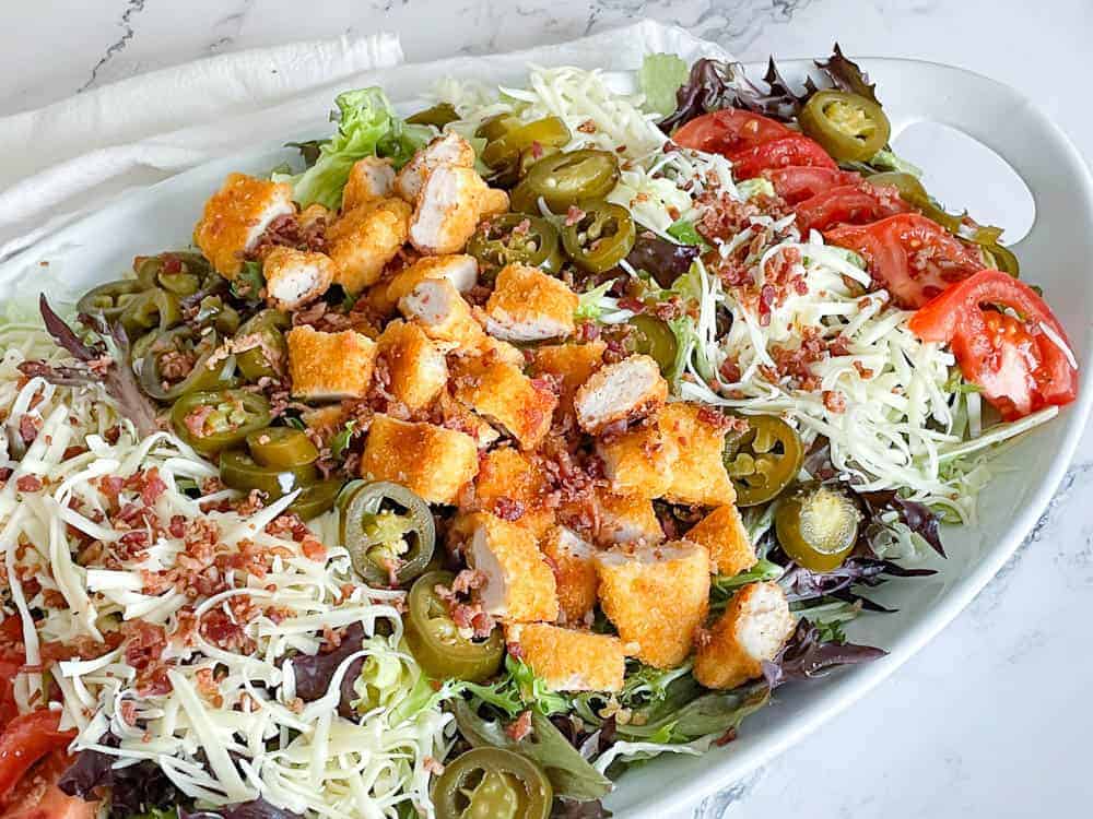 A plate of Wendy's jalapeño popper salad.